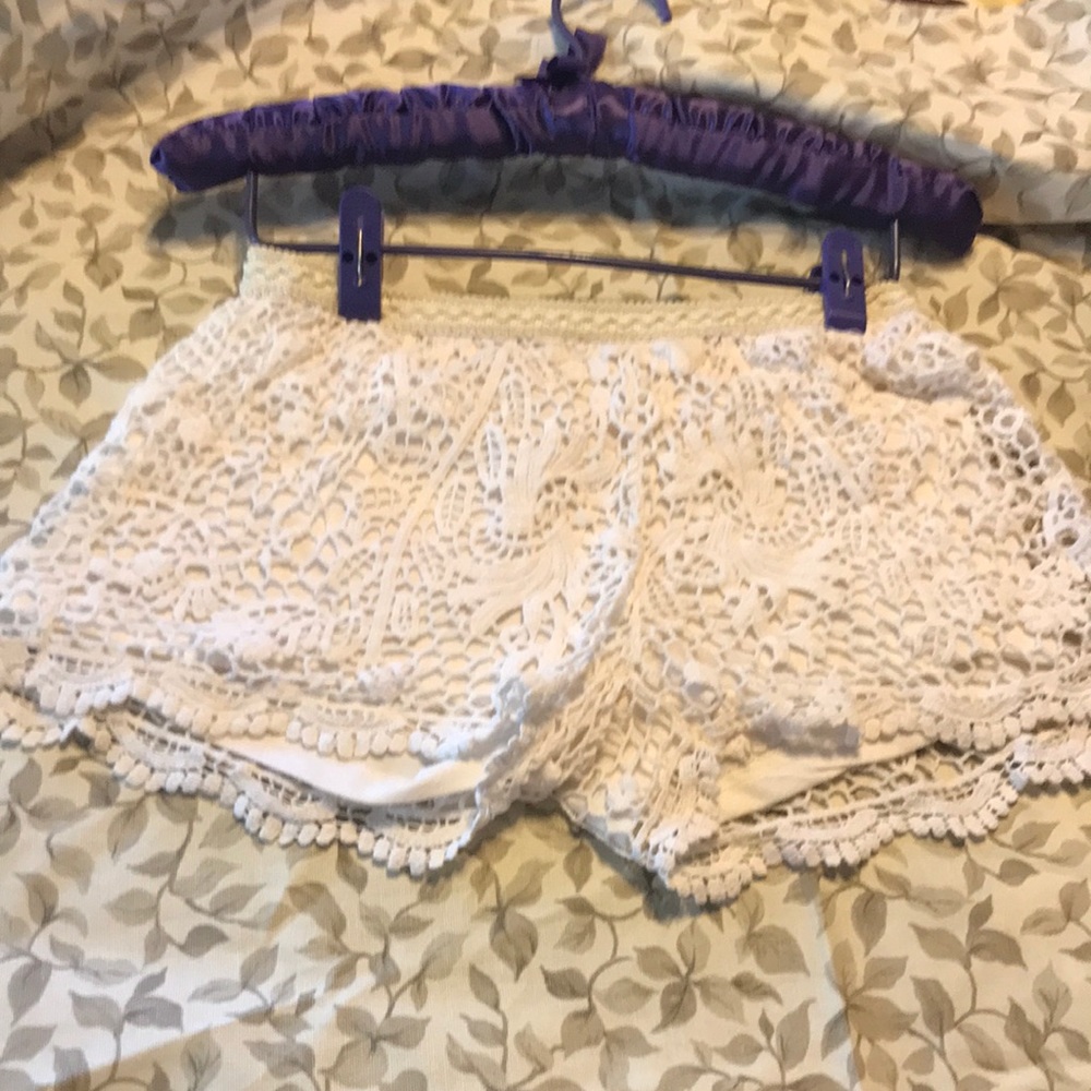 Adorable cotton lace shell with polyester and rayon lining.